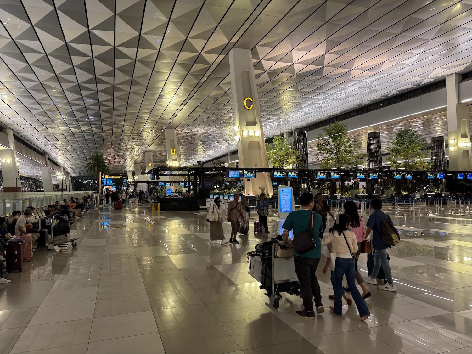 people walking in a large airport