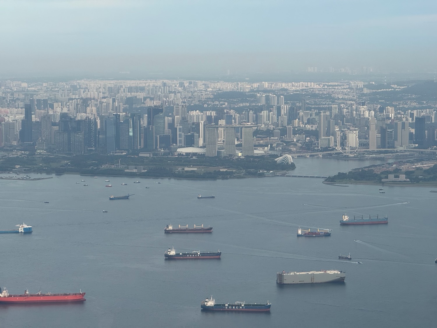 a large city with many ships in the water
