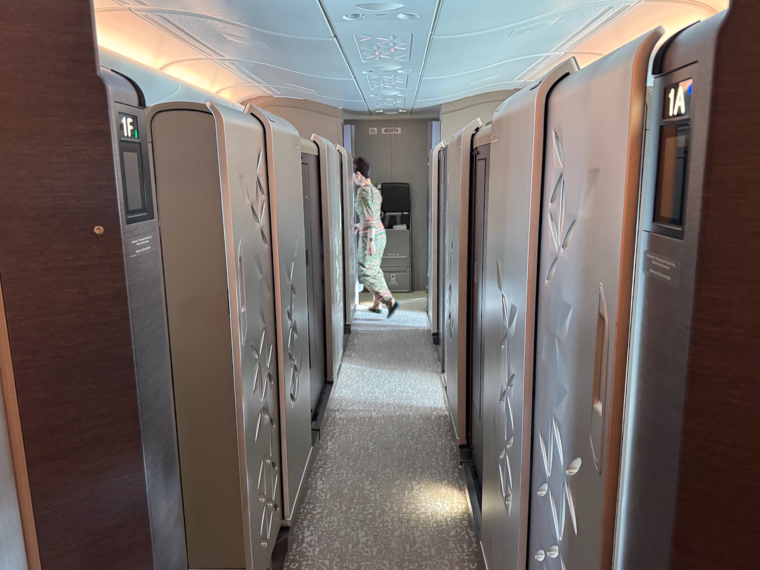 a woman walking in a row of lockers