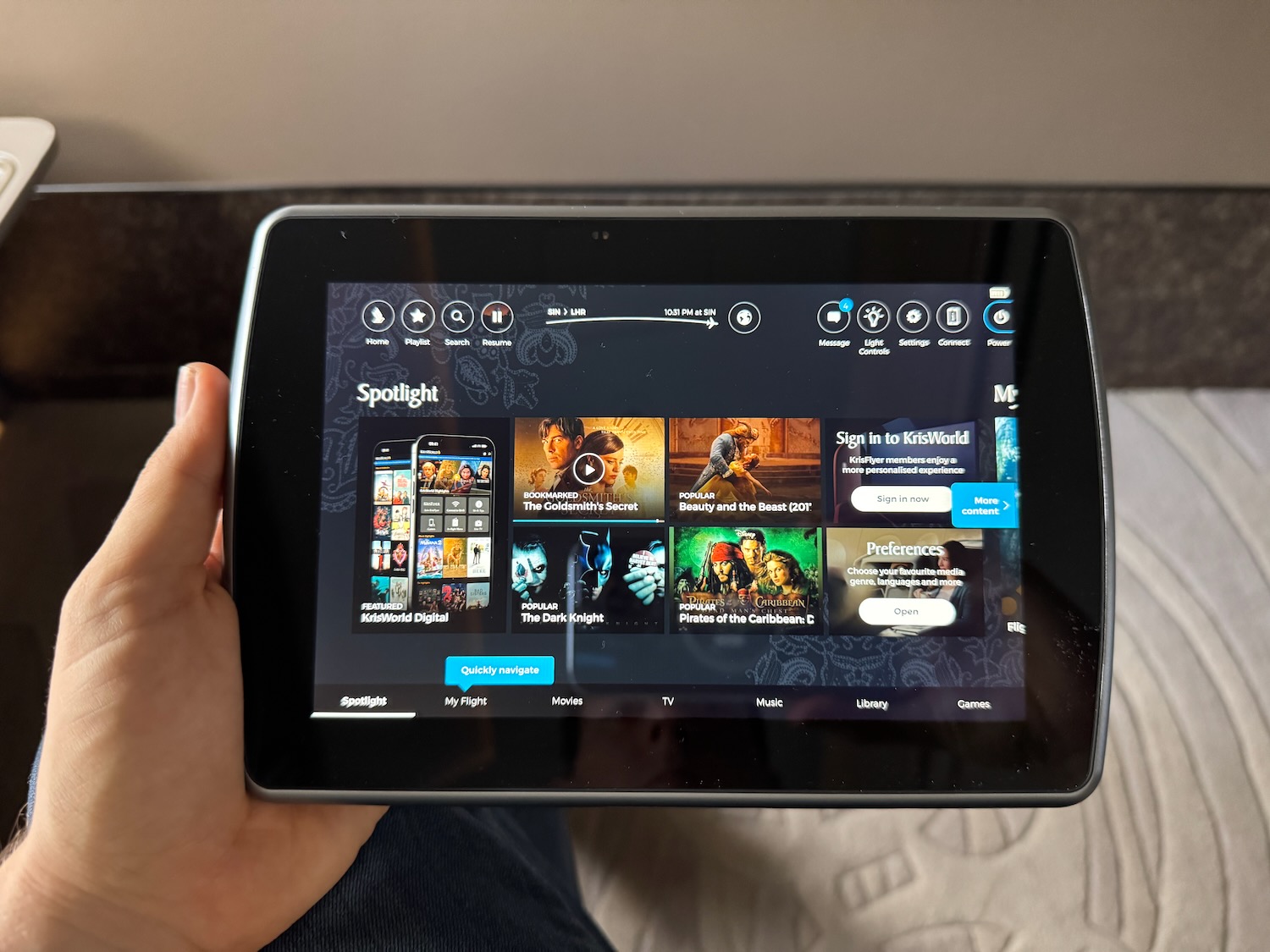 a hand holding a tablet