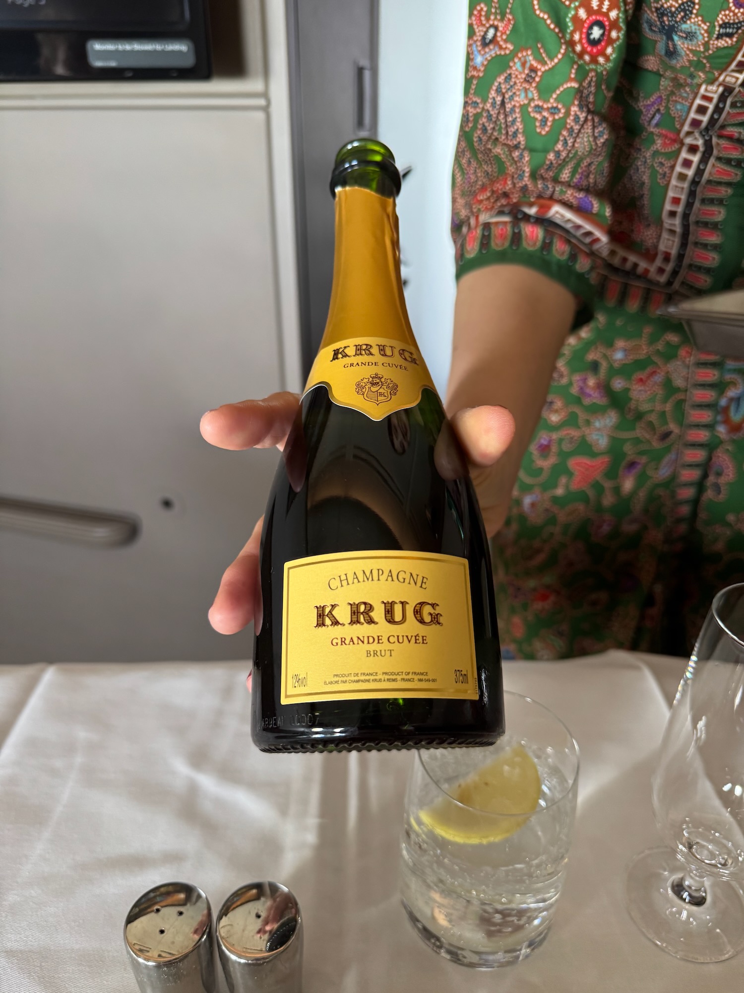 a person holding a bottle of champagne