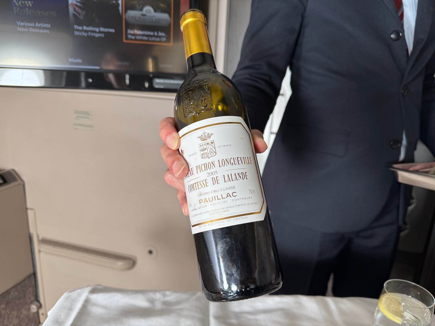 a person holding a bottle of wine